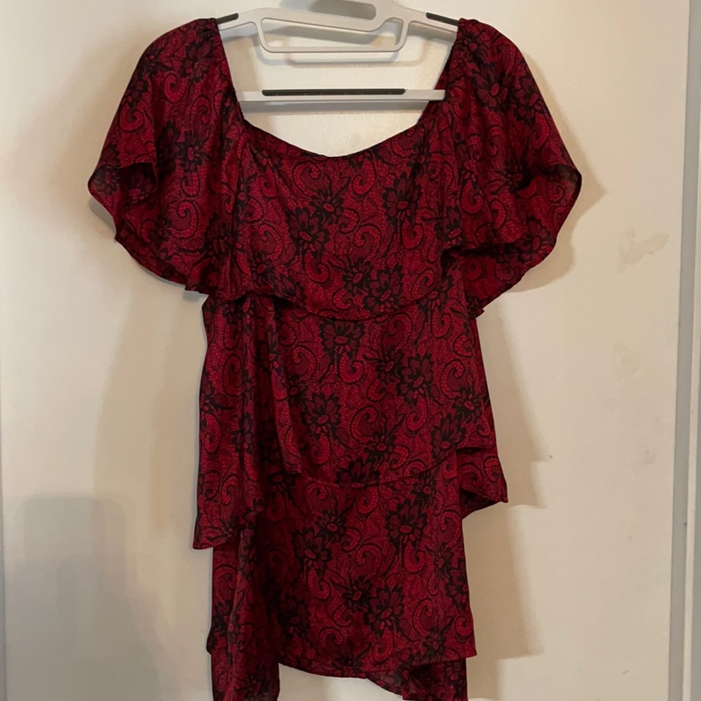 Red Shirt with black design. Size Large